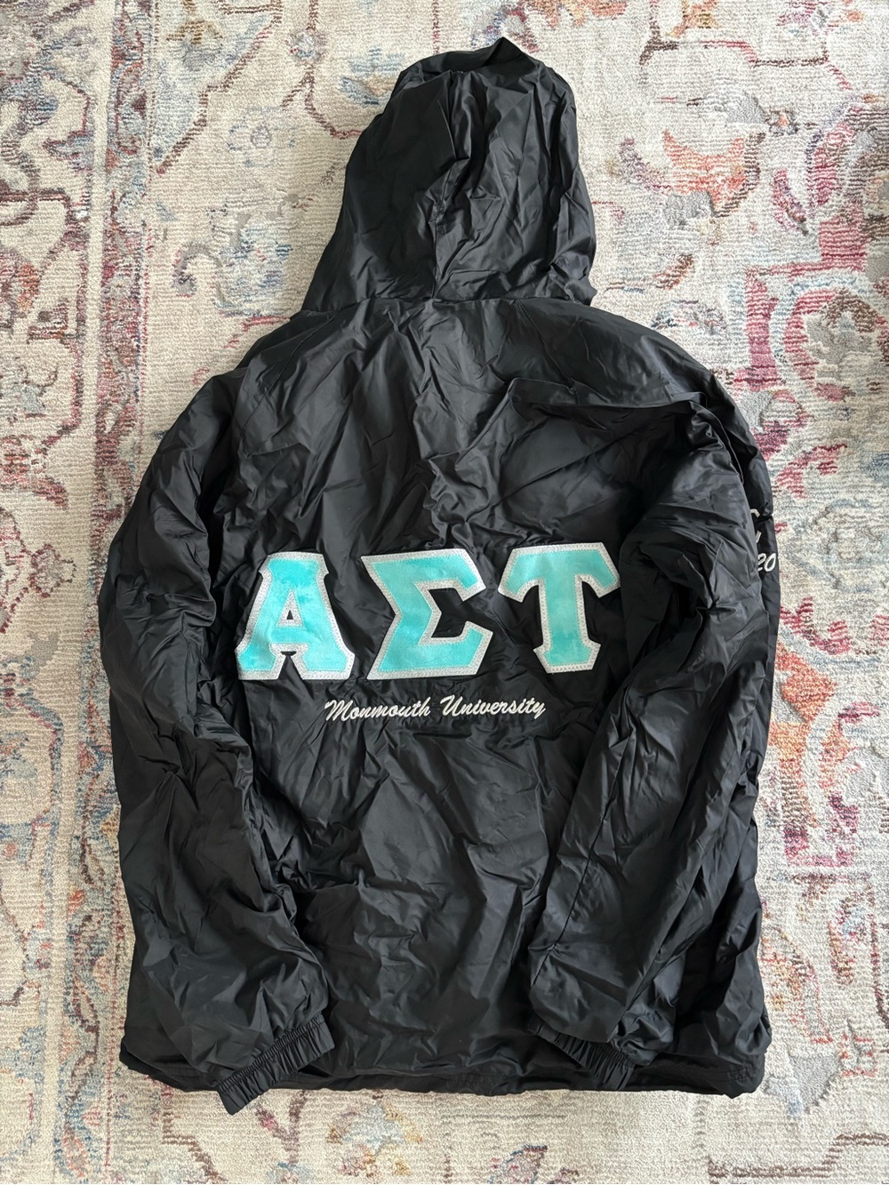 Charles River Apparel Black Hooded Windbreaker with Teal Greek Letters